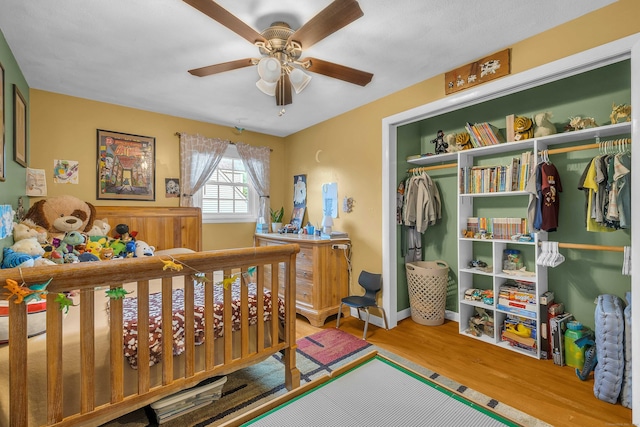 34 Fleming Ct, Groton, CT 06340 - bedroom featuring wood finished floors, a closet, and a ceiling fan