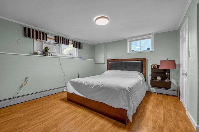 34 Fleming Ct, Groton, CT 06340 - bedroom with crown molding, wood finished floors, a baseboard heating unit, and cooling unit