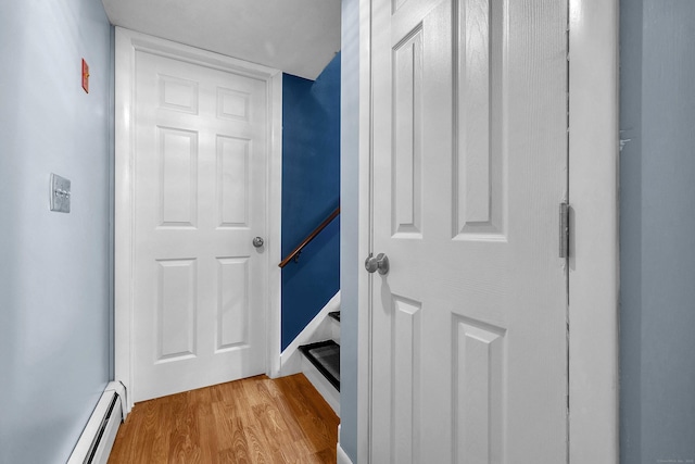 34 Fleming Ct, Groton, CT 06340 - hall with a baseboard heating unit and light wood finished floors