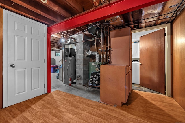 34 Fleming Ct, Groton, CT 06340 - unfinished below grade area with washer / clothes dryer, water heater, and wood finished floors