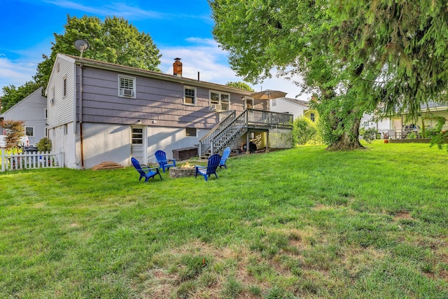 34 Fleming Ct, Groton, CT 06340 - rear view of property featuring a deck, stairs, a chimney, and a fire pit