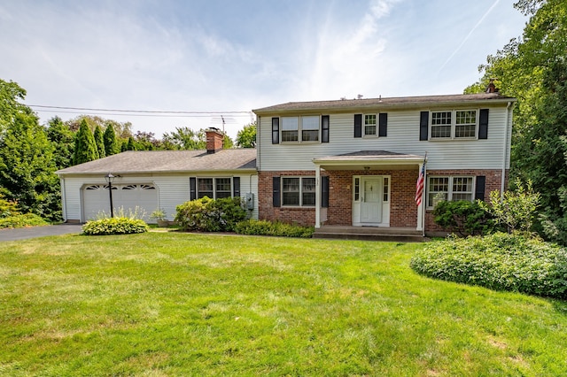 198 N Timber Ln, Cheshire, CT 06410 - view of front facade featuring a chimney, a garage, brick siding, driveway, and a front lawn
