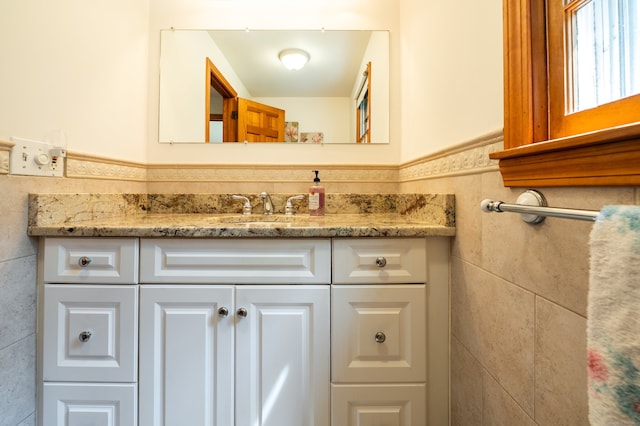 198 N Timber Ln, Cheshire, CT 06410 - bathroom featuring vanity, tile walls, and a wainscoted wall