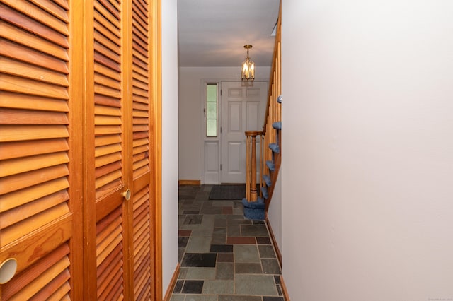 198 N Timber Ln, Cheshire, CT 06410 - hallway with stone finish flooring and a chandelier