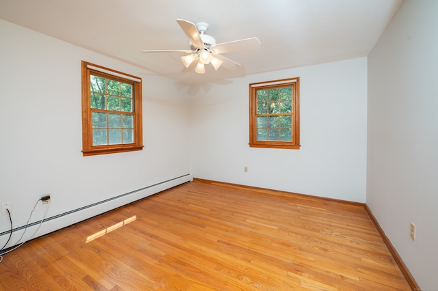 198 N Timber Ln, Cheshire, CT 06410 - unfurnished room with baseboard heating, healthy amount of natural light, and light wood-style flooring