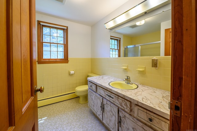 198 N Timber Ln, Cheshire, CT 06410 - full bath featuring a baseboard radiator, plenty of natural light, tile walls, an enclosed shower, and vanity