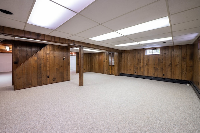 198 N Timber Ln, Cheshire, CT 06410 - basement featuring wood walls, carpet, a drop ceiling, and a baseboard radiator