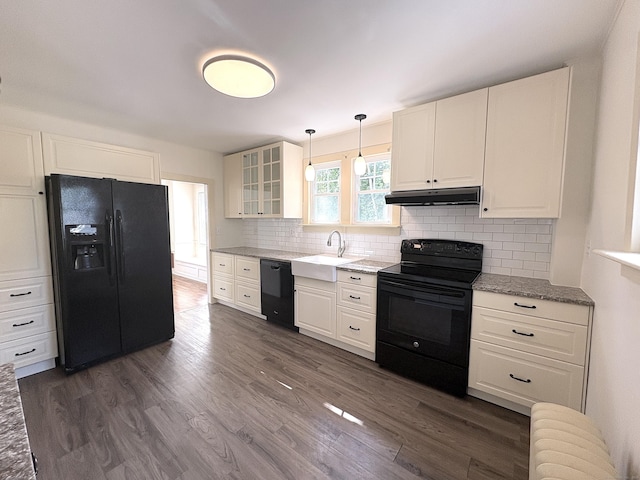 3 Mountain View Ave, Enfield, CT 06082 - kitchen featuring black appliances, under cabinet range hood, glass insert cabinets, tasteful backsplash, and white cabinets