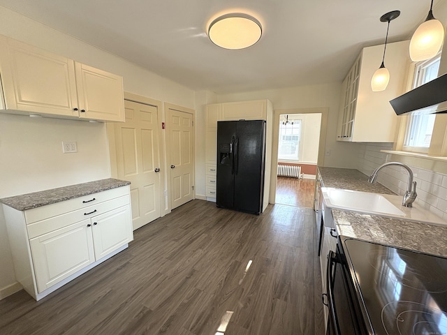 3 Mountain View Ave, Enfield, CT 06082 - kitchen with black appliances, radiator, healthy amount of natural light, and dark wood-type flooring