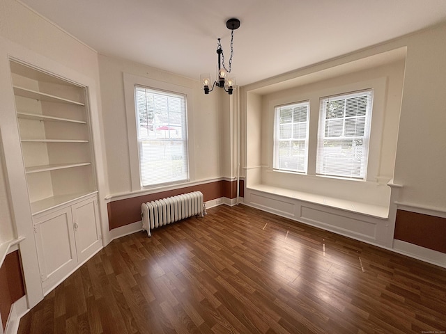 3 Mountain View Ave, Enfield, CT 06082 - unfurnished dining area featuring radiator, a chandelier, plenty of natural light, and dark wood-style floors