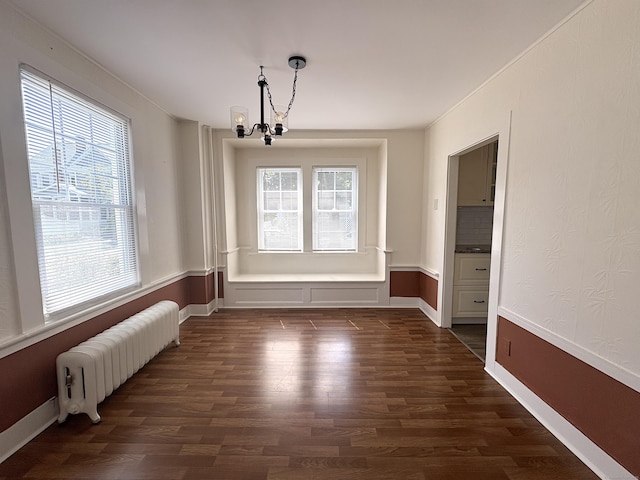 3 Mountain View Ave, Enfield, CT 06082 - unfurnished dining area featuring radiator heating unit, a chandelier, and dark wood-style floors
