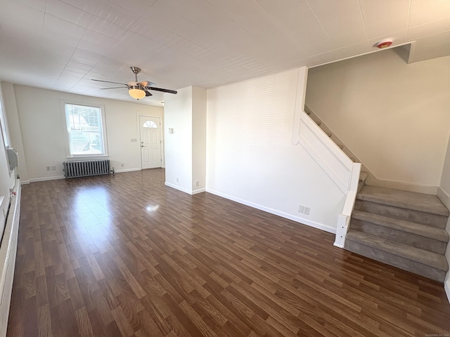 3 Mountain View Ave, Enfield, CT 06082 - unfurnished living room with radiator, stairway, dark wood-style flooring, and a ceiling fan