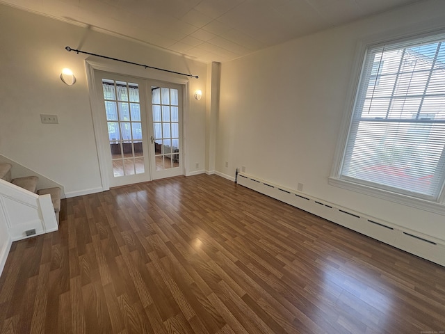 3 Mountain View Ave, Enfield, CT 06082 - unfurnished room with a baseboard heating unit, dark wood-style floors, stairway, and french doors