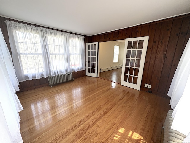 3 Mountain View Ave, Enfield, CT 06082 - spare room with radiator, baseboard heating, light wood finished floors, and wood walls