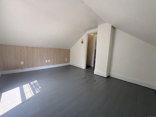 3 Mountain View Ave, Enfield, CT 06082 - additional living space with lofted ceiling, wood walls, and dark wood-type flooring