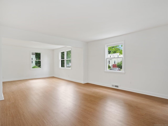 62 Severance Dr, Stamford, CT 06905 - unfurnished room with healthy amount of natural light and light wood-style floors