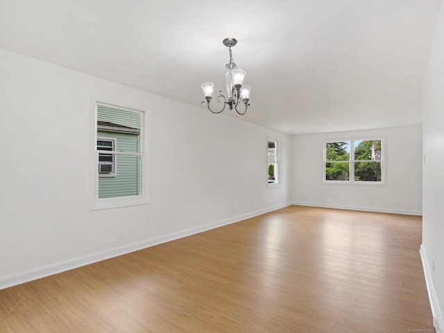 62 Severance Dr, Stamford, CT 06905 - unfurnished room with a chandelier and light wood finished floors