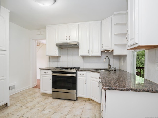 62 Severance Dr, Stamford, CT 06905 - kitchen featuring stainless steel gas range oven, under cabinet range hood, tasteful backsplash, white cabinetry, and open shelves