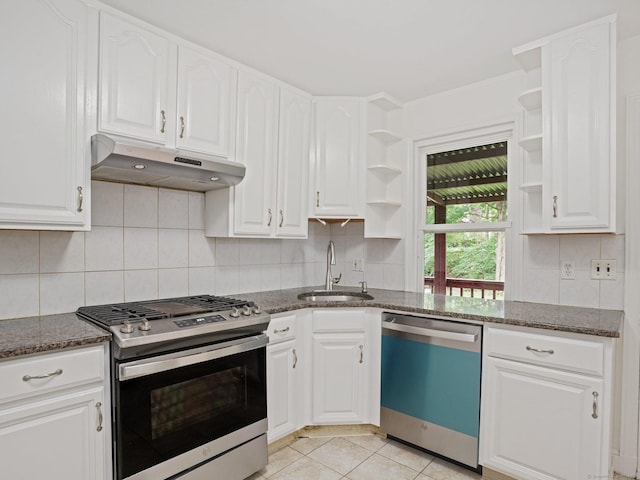 62 Severance Dr, Stamford, CT 06905 - kitchen featuring dishwasher, open shelves, stainless steel range with gas stovetop, under cabinet range hood, and dark stone counters