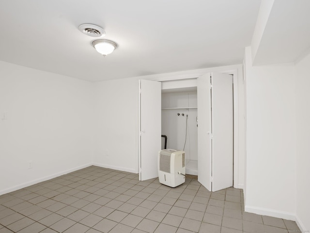 62 Severance Dr, Stamford, CT 06905 - unfurnished bedroom featuring a closet and light tile patterned floors