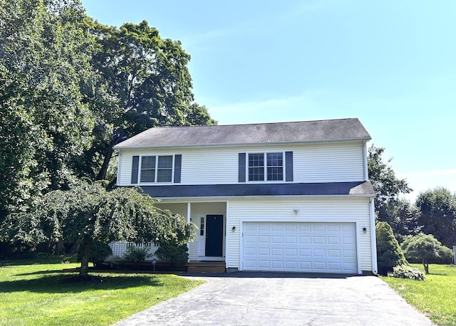 41 Calloway Dr, Milford, CT 06461 - traditional home featuring a garage, asphalt driveway, and a front yard