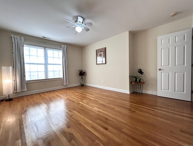 41 Calloway Dr, Milford, CT 06461 - empty room with ceiling fan, wood finished floors, and a smoke detector
