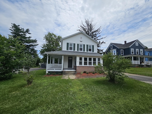 24 Lake Ave, Danbury, CT 06810 - farmhouse with a porch, a front lawn, brick siding, and driveway