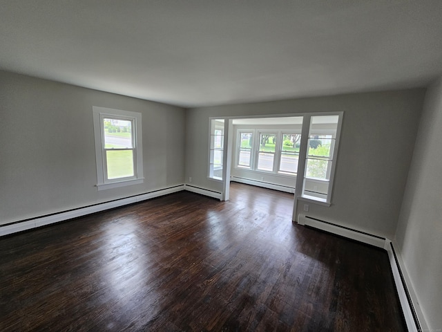 24 Lake Ave, Danbury, CT 06810 - empty room with a baseboard radiator, dark wood-type flooring, healthy amount of natural light, and a baseboard heating unit