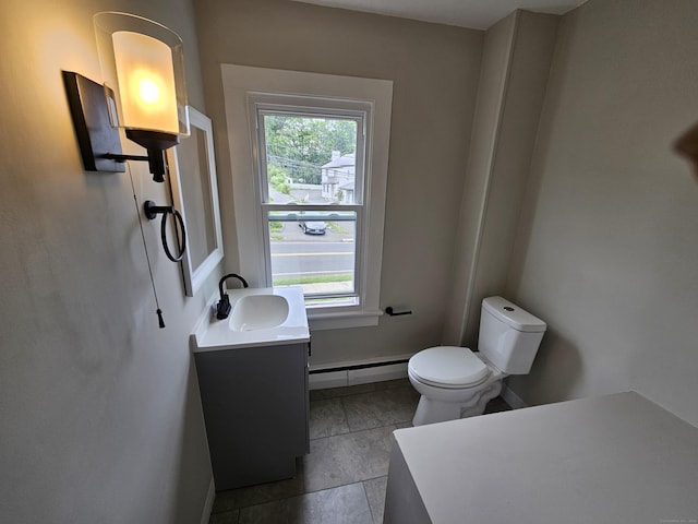 24 Lake Ave, Danbury, CT 06810 - bathroom with baseboard heating, vanity, and tile patterned flooring