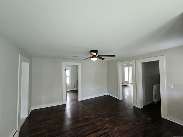 24 Lake Ave, Danbury, CT 06810 - unfurnished room featuring radiator, healthy amount of natural light, a baseboard heating unit, and dark wood-style floors