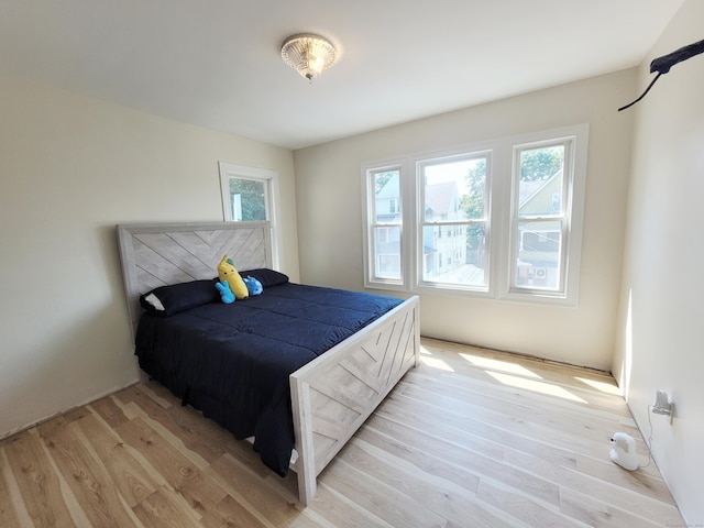 21 Arch St, Waterbury, CT 06710 - bedroom with light wood-style floors and multiple windows