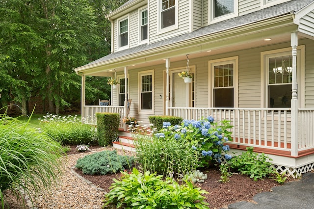 15 Tisbury Rd, Old Lyme, CT 06371 - view of front of property featuring covered porch and roof with shingles