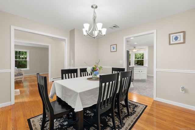 15 Tisbury Rd, Old Lyme, CT 06371 - dining room with a chandelier, light wood-style flooring, and a ceiling fan