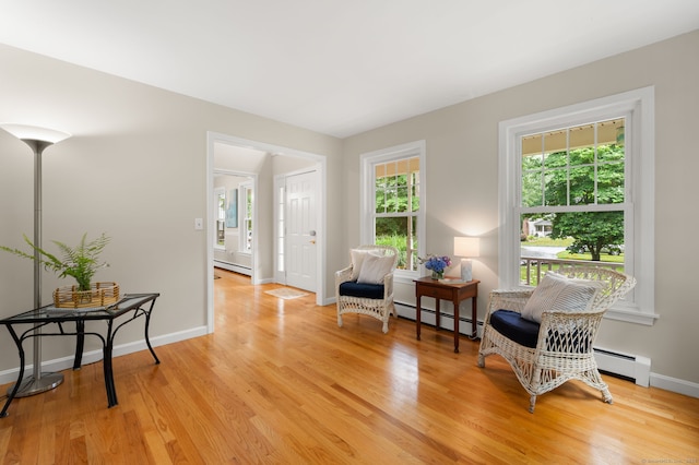 15 Tisbury Rd, Old Lyme, CT 06371 - sitting room featuring light wood finished floors, a baseboard heating unit, and a baseboard radiator