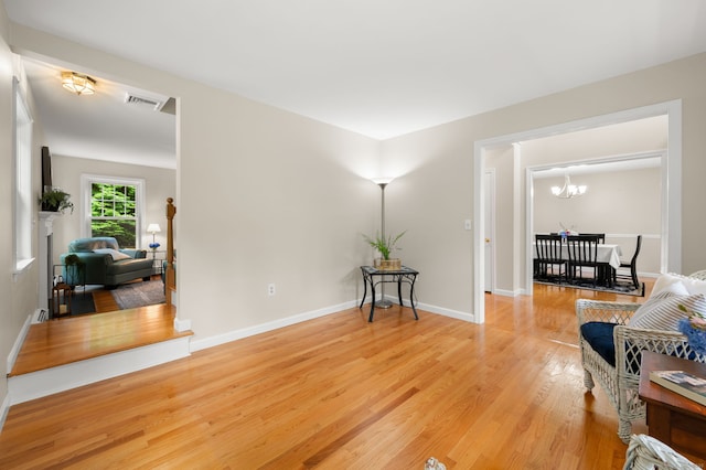 15 Tisbury Rd, Old Lyme, CT 06371 - living area featuring a chandelier and wood finished floors