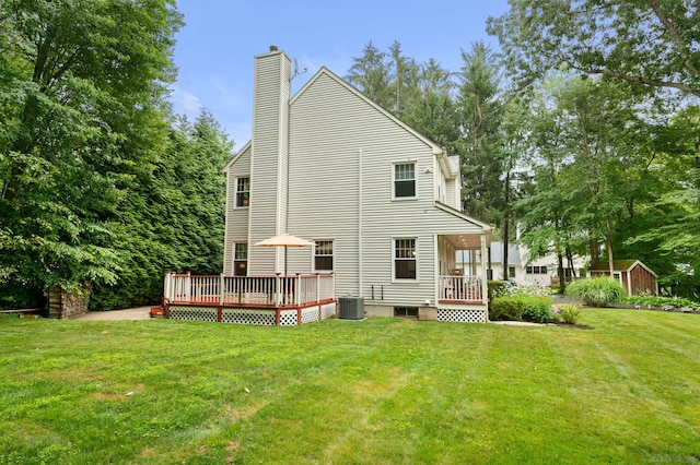 15 Tisbury Rd, Old Lyme, CT 06371 - back of property with a chimney, a yard, and a deck