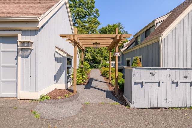 291 Heritage Vlg Unit C, Southbury, CT 06488 - view of property exterior with roof with shingles and a pergola
