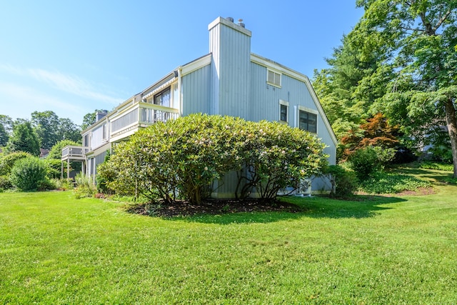 291 Heritage Vlg Unit C, Southbury, CT 06488 - view of side of property featuring a chimney and a yard