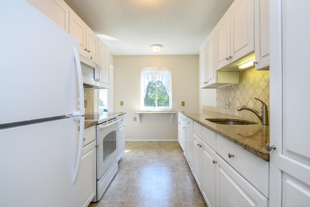 291 Heritage Vlg Unit C, Southbury, CT 06488 - kitchen featuring white appliances, backsplash, white cabinets, and a textured ceiling
