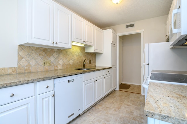 291 Heritage Vlg Unit C, Southbury, CT 06488 - kitchen with white appliances, white cabinetry, decorative backsplash, and a textured ceiling