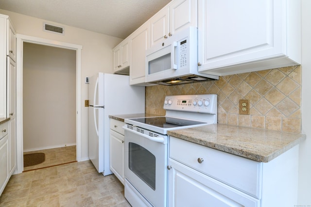 291 Heritage Vlg Unit C, Southbury, CT 06488 - kitchen featuring white appliances, decorative backsplash, white cabinets, and light stone countertops