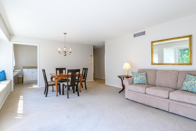 291 Heritage Vlg Unit C, Southbury, CT 06488 - living room featuring a chandelier and light carpet