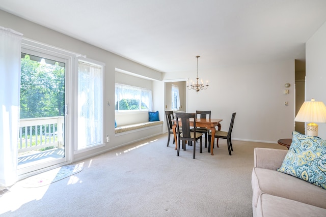 291 Heritage Vlg Unit C, Southbury, CT 06488 - carpeted dining space featuring a chandelier and baseboards