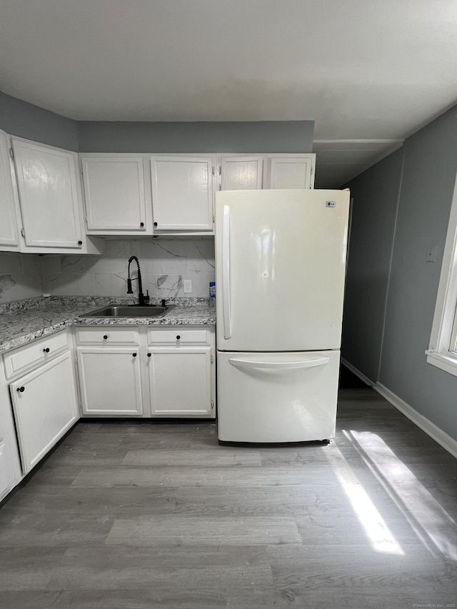 6 Victory Dr, New Haven, CT 06515 - kitchen featuring freestanding refrigerator, white cabinets, and wood finished floors