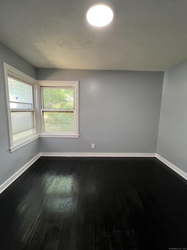 6 Victory Dr, New Haven, CT 06515 - empty room featuring dark wood-style floors and a textured ceiling