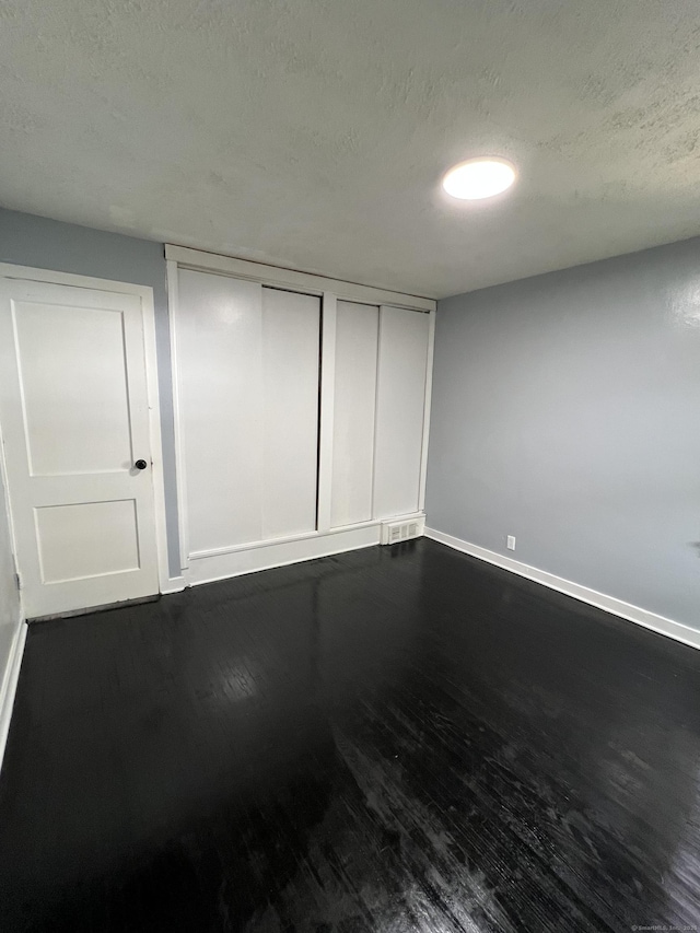 6 Victory Dr, New Haven, CT 06515 - unfurnished room with dark wood-style floors and a textured ceiling