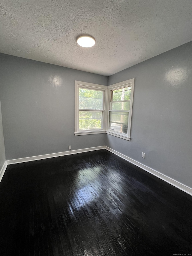 6 Victory Dr, New Haven, CT 06515 - spare room with dark wood-style flooring and a textured ceiling
