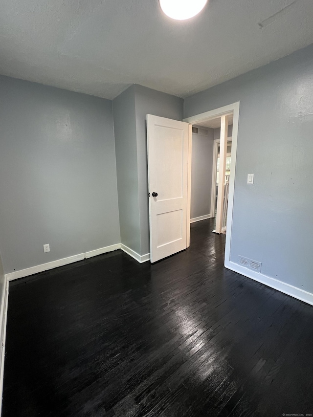 6 Victory Dr, New Haven, CT 06515 - empty room with baseboards and dark wood-style floors