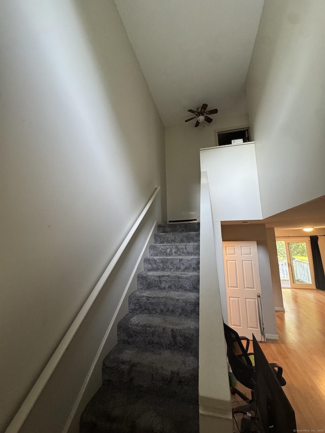 4 Starrwood Dr Unit 4, Norwich, CT 06360 - staircase with high vaulted ceiling, wood finished floors, and a ceiling fan