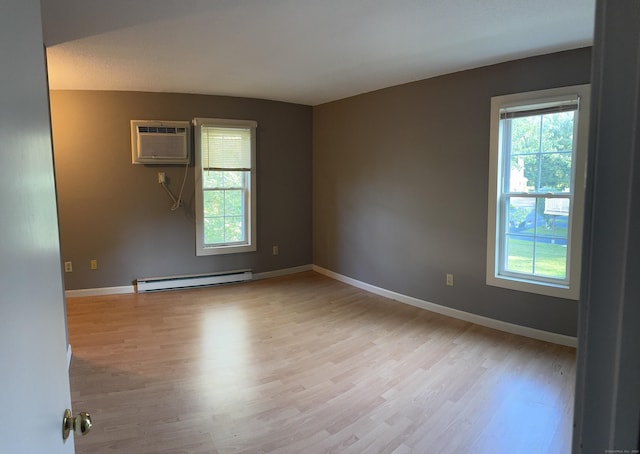 4 Starrwood Dr Unit 4, Norwich, CT 06360 - unfurnished room with a baseboard radiator, light wood-type flooring, and plenty of natural light